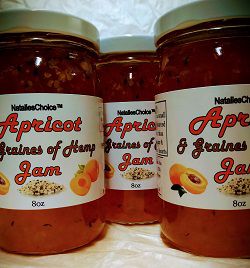 Glass jars apricot hemp jams close up of three jars lined up.
