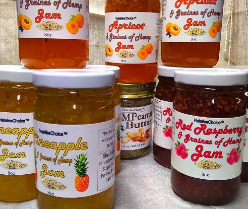 7 fruit jam jars and 1 jar of Hempeanut butter, white labels, natalieschoice logo.
