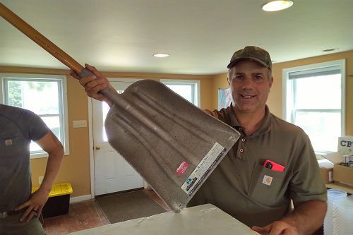 Farmer Steve Groff of Lancaster Holding a Hempy Shovel in his office