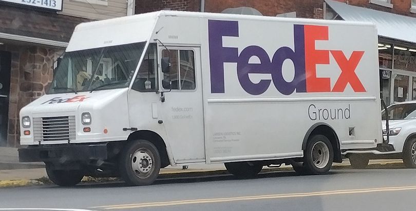 Big White Fedex Ground Truck in front of Wrightsville businesses