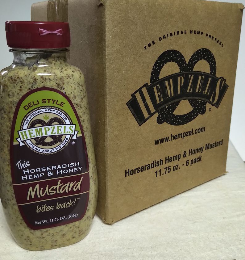 Bottle of Hempzels(tm) Horseradish Money next to box with old pretzel logo image.