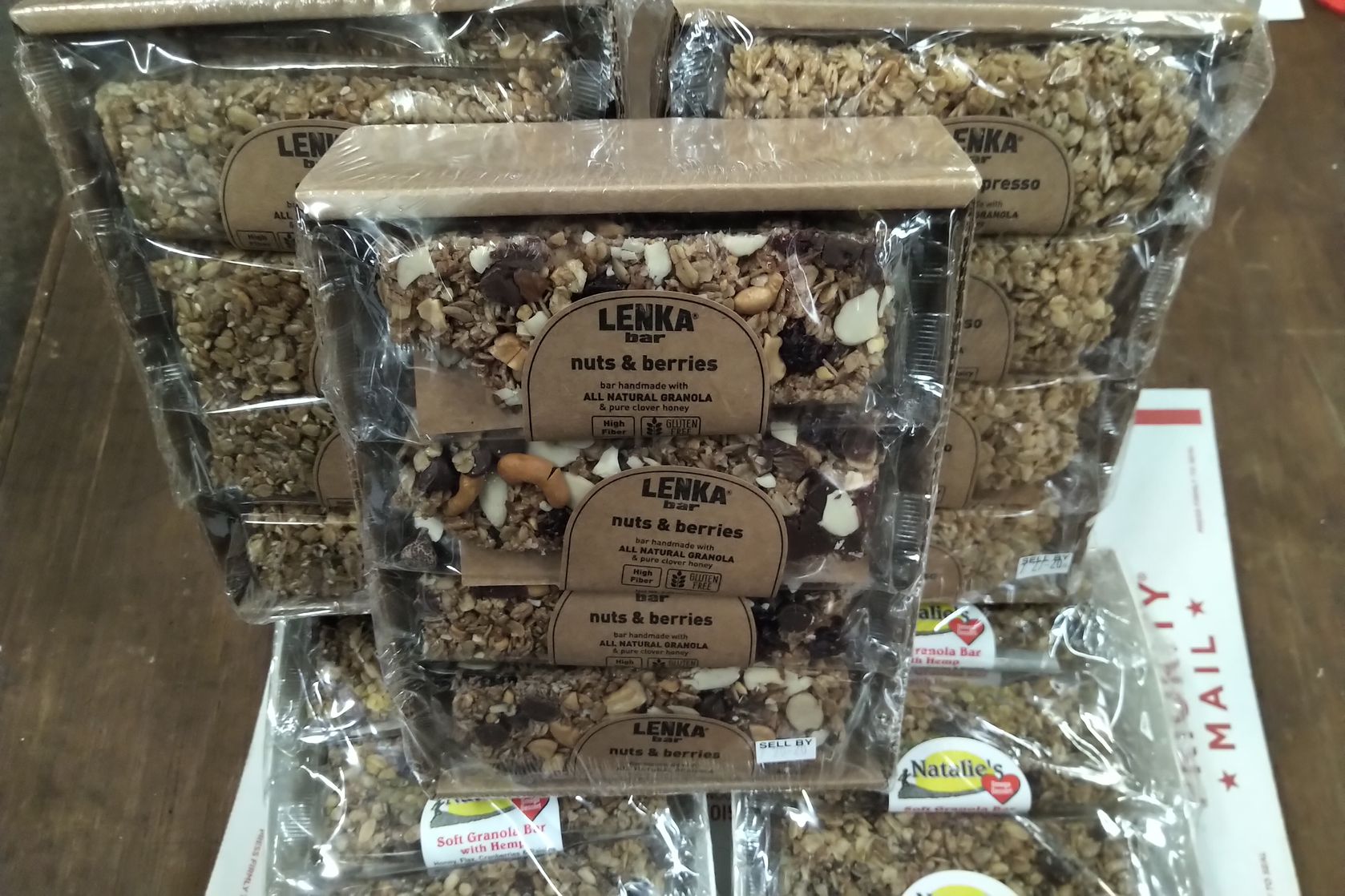 stacked Lenka and Natalie Organic Granola bars wrapped for display all brown colors.