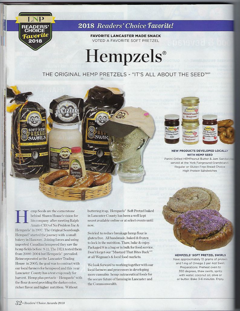 Hemp Seed Glass Head with Hempzels Hat next to black & gold bags of soft swirls and a gallon of mustard with a bottle of mustard surrounded by pretzel swirls and jars of hempeanut butter & hamp jams. Award Winning LNP logo in black in gold.