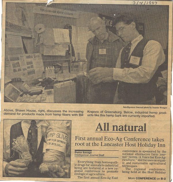Black and white newspaper article All Natural with Shawn House in vest showing hemp fibers to attendee.