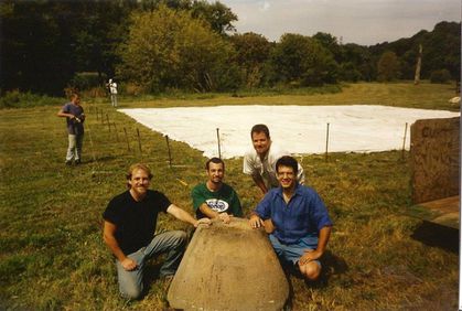 A hemp millstone with Les STark, Tony G, Jim Stark & Shawn House with the white tent laying on the ground.
