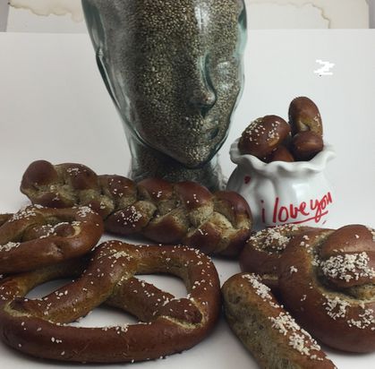 Glass head filled with hemp seed and surrounded by salted soft hemp high protein pretzels.