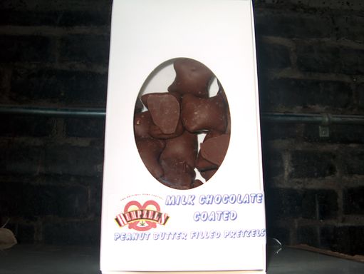 Chocolate Covered pretzel Nuggets in a white box with a Hempzels logo onit.