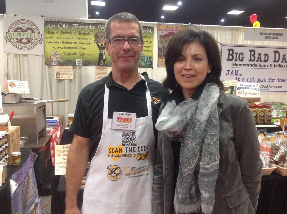 Chef Shawn with Italian Chef standing in front of his booth at the Gourmet Food Show with oven and signs