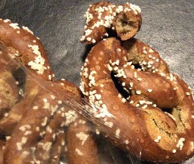 3 Brown Salted Crunchy Sourdough Hemp Pretzels on display.